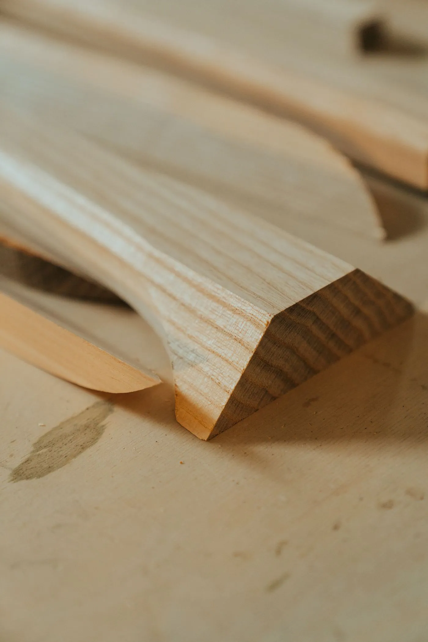 Close-up of pale timber offcuts with clean cut edges